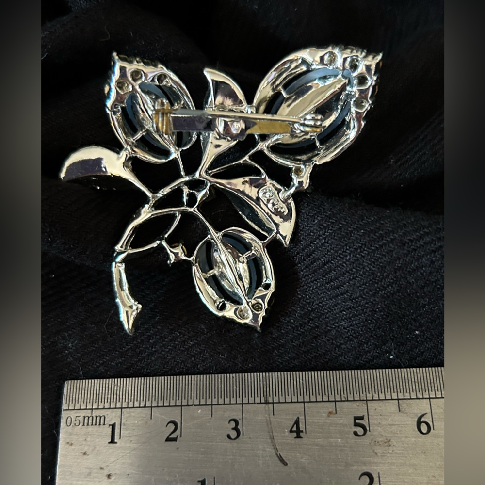 Unique silver tone and blue floral brooch
